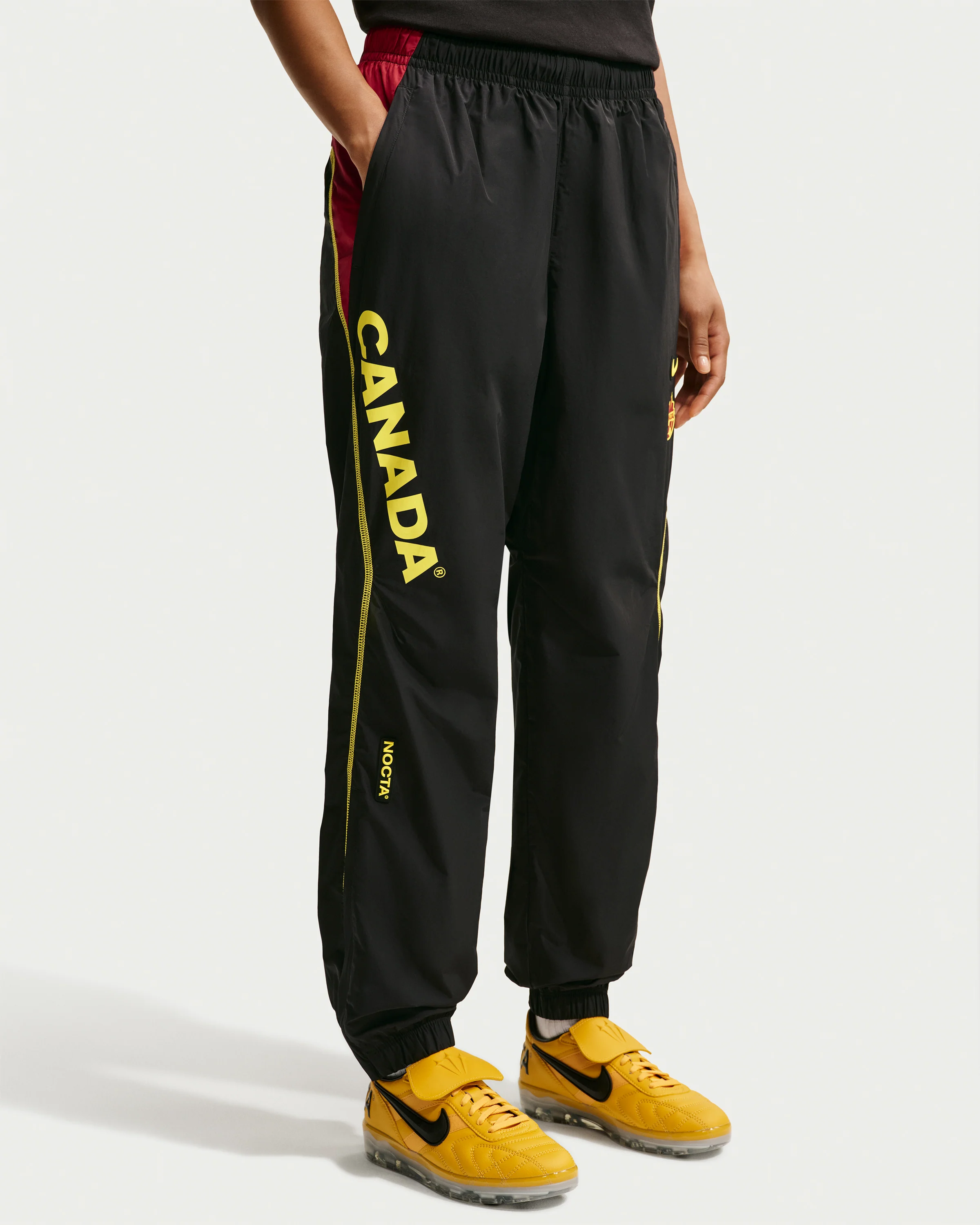 NIKE X NOCTA CA TRACK PANT - BLACK/ GYM RED - Image 2