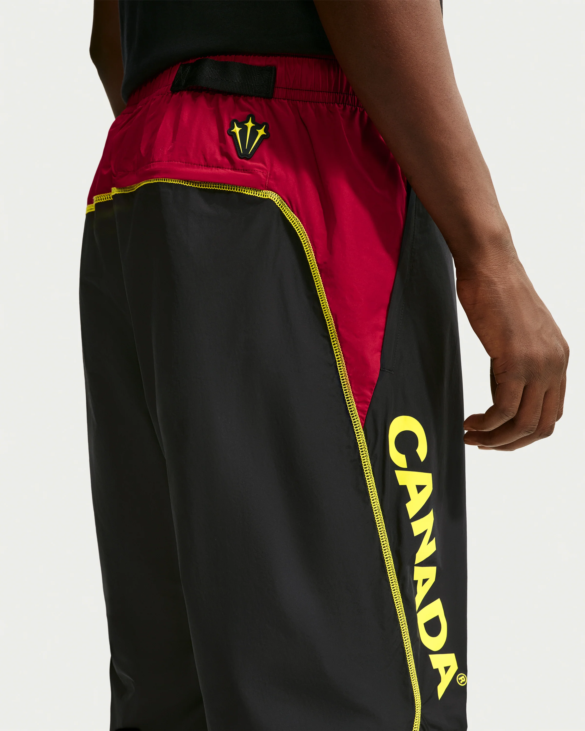 NIKE X NOCTA CA TRACK PANT - BLACK/ GYM RED - Image 3