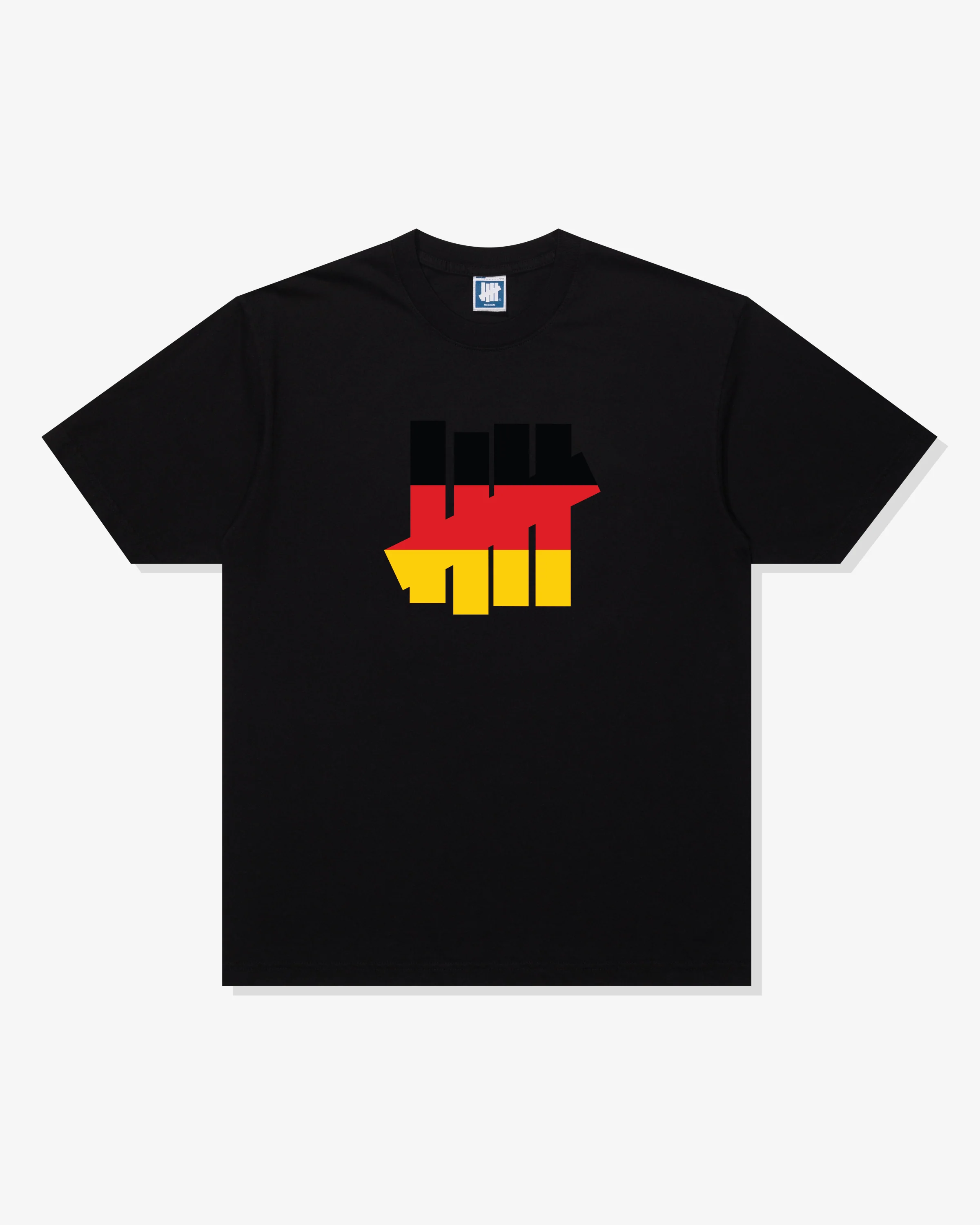 UNDEFEATED ICON FLAG S/S TEE - GERMANY