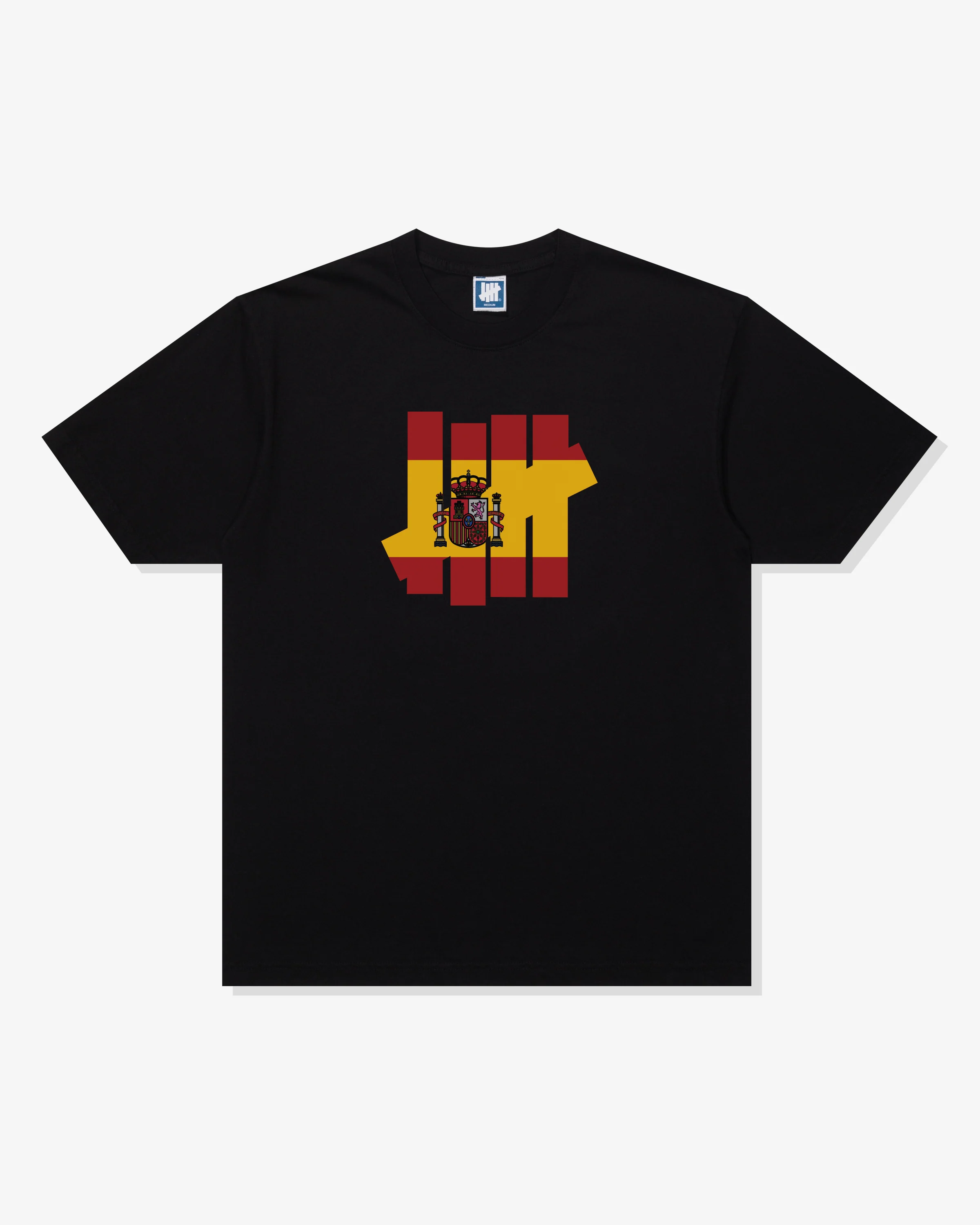 UNDEFEATED ICON FLAG S/S TEE - SPAIN